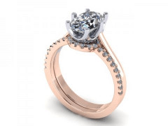 A rose gold engagement ring with a diamond set in the center.