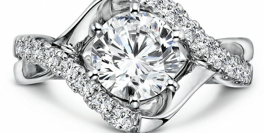 An oval diamond halo engagement ring in white gold.
