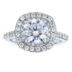 A diamond ring with a halo of diamonds around it